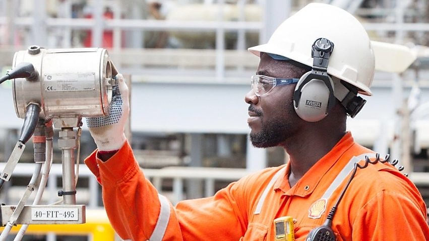 A shell employee working on a plant