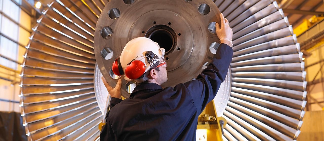 Engineer Inspecting Turbine