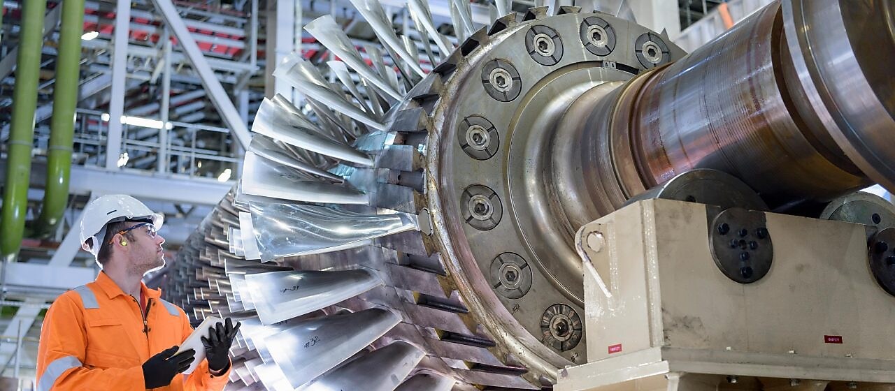Gas turbine under repair in gas-fired power station.