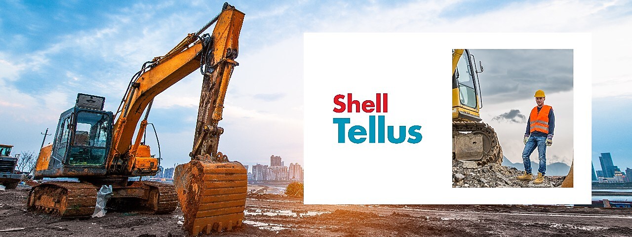 Yellow digger and construction worker