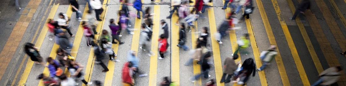 People crossing a busy street in Hong Kong