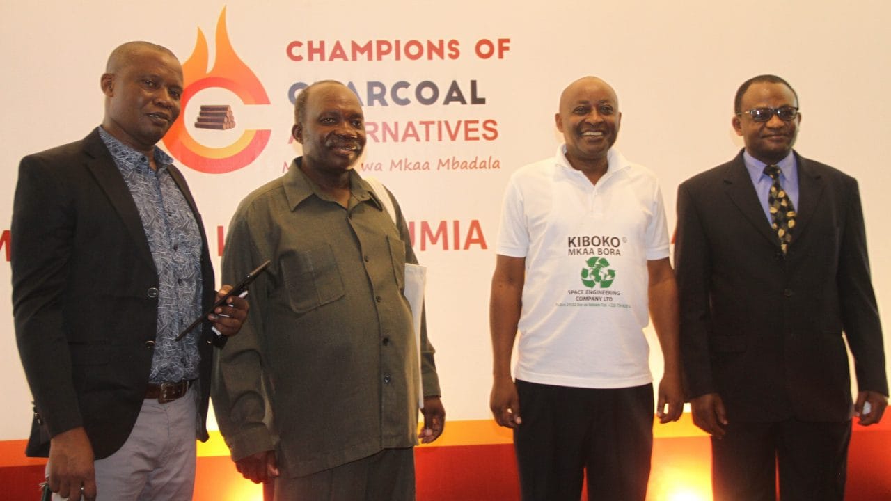 3  Institute of Management and Entrepreneurship Development CEO Dr. Donath Ulomi Posed for a photo with the winners of a competition on alternative energy. From Left Leonard Kushoka, Anyelwise Mahenge and Philip Mtui.