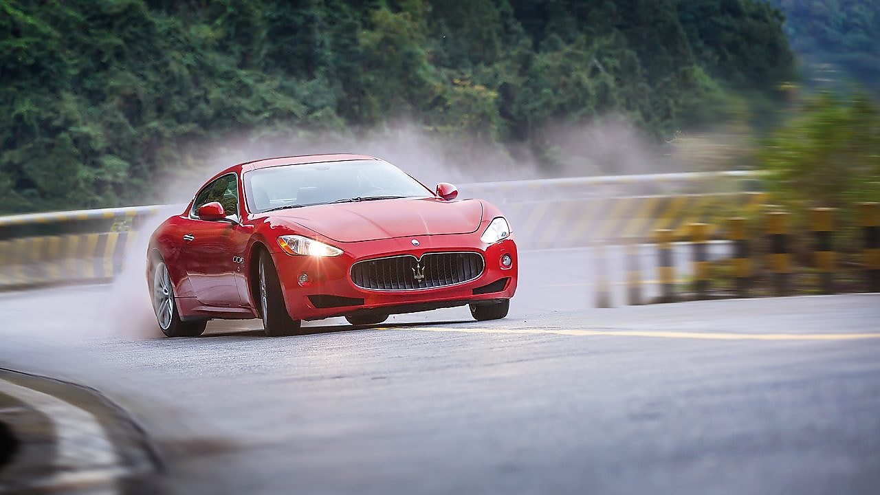 A red Maserati speeds uphill in the Shell Helix Ultra film We Know Why You Drive