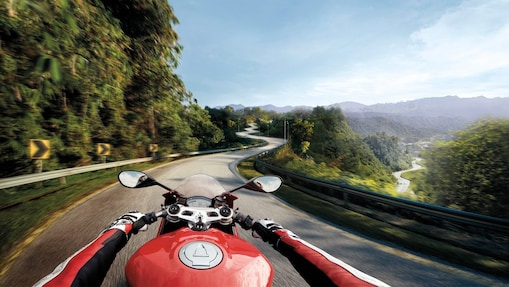 Man riding a bike which is using the Superior Engine Oil For Bikes