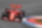 A red Scuderia Ferrari sits on a racing track, an example of Shell Helix Ultra’s Innovation Partnership