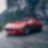 A red Maserati with standard Shell Helix Ultra product proudly sits on a scenic mountain road