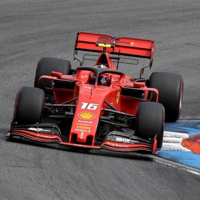 A red Scuderia Ferrari sits on a racing track, an example of Shell Helix Ultra’s Innovation Partnership